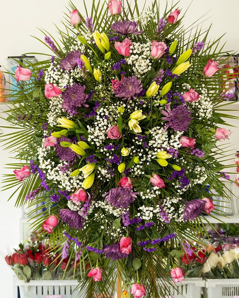 White wreath spray. . Standing pray Funeral flowers